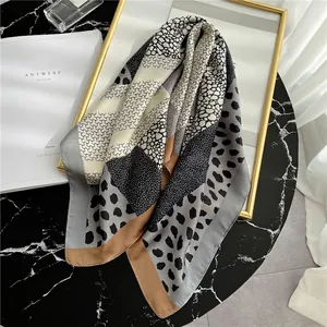 Leopard print color-block silk scarf shawl with geometric patterns and camel border