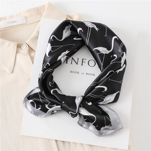 Detail of silk-feel square scarf with flamingo print and neat stitched edges