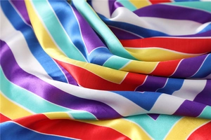 Macro shot of colorful striped satin scarf fabric with vibrant herringbone pattern