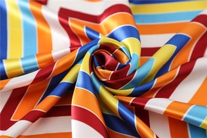 Close-up of vibrant striped satin scarf showing smooth texture and glossy silk fabric