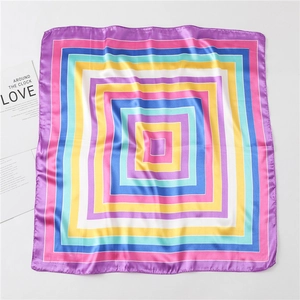 Detail of colorful geometric striped satin square scarf with premium rolled hem stitching
