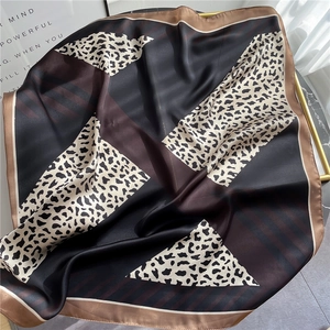 Elegant leopard print silk scarf with geometric patchwork and champagne gold satin border