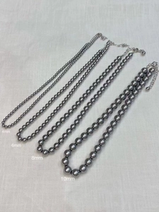 Detail showing grey pearl necklaces in four sizes 4mm 6mm 8mm and 10mm with lobster clasps