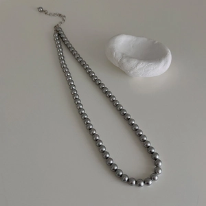 Close-up of grey pearl necklace with silver adjustable chain and lobster clasp