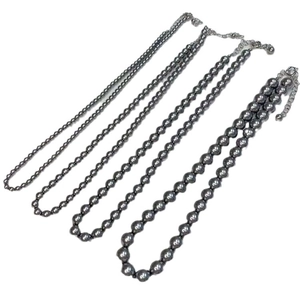 Elegant grey pearl necklace set featuring four graduated sizes with silver metal clasps
