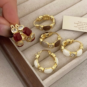 Elegant gold-edged hoop earrings with colorful enamel and cubic zirconia stones