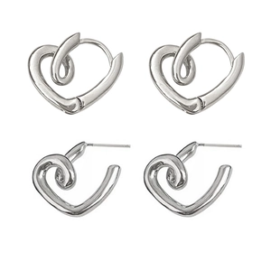Minimalist silver heart hoop earrings with twisted metallic design on white background