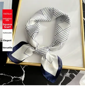 Detail of 70x70cm faux silk square scarf with geometric blue lines and satin finish