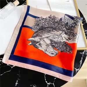 Detail of artistic horse head and floral pattern on premium square silk scarf