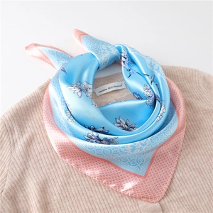 Elegant sky blue and pink silk scarf with geometric diamond patterns and floral print
