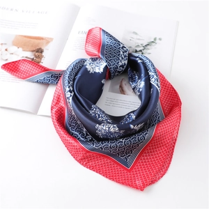 Elegant silk scarf with navy and red floral lattice patterns on a white background
