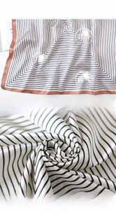 Close-up of striped satin silk scarf texture with professional neat stitching edges