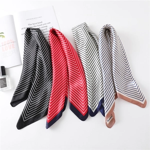 Elegant striped square scarves in four colors with minimalist magazine and perfume props