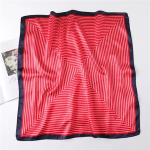 Close-up of red and white striped silk square scarf with navy blue border edges