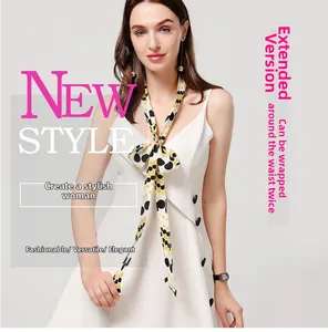 Polka dot skinny scarf in yellow and black shown wrapped twice around the waistline