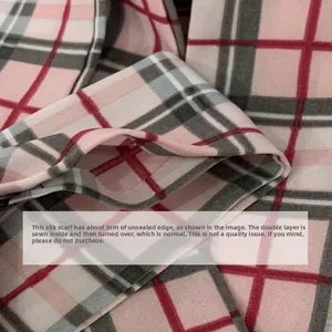 Detail showing the 3cm turning opening and neat double-stitched edge on pink plaid silk scarf