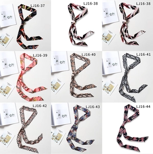 Collection of chic skinny silk scarves in various elegant patterns and snake prints