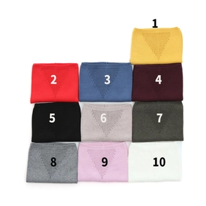Grid view of 10 solid color knitted gaiters showing various shades and breathable patterns