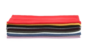 Stack of multi-color knitted neck gaiters showing various shades and soft ribbed texture