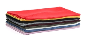 Detailed view of stacked knit neck warmers showing various colors and soft texture