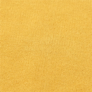 Close-up of bright yellow knit fabric texture showing fine weave for winter neck warmer