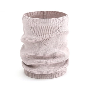 Macro shot of light pink knit snood with unique triangular breathable texture and ribbed hem