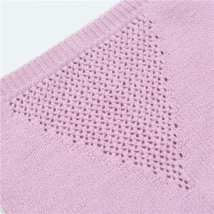 Macro detail of pale pink knit neck warmer showing breathable triangular mesh patterns