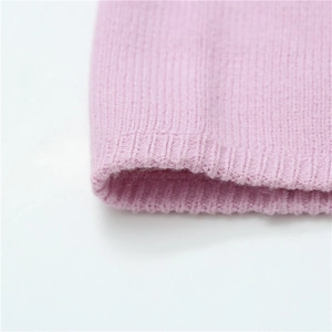 Detail of pink knitted neck gaiter showing premium rib-knit texture and soft elastic fabric