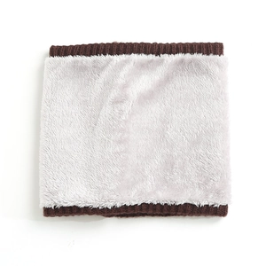 Detailed view of winter neck warmer with brown knit exterior and soft white faux fur lining