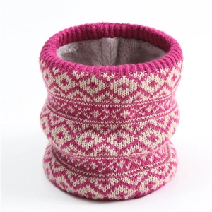 Close-up of knit winter neck warmer with pink geometric pattern and thick grey fleece lining