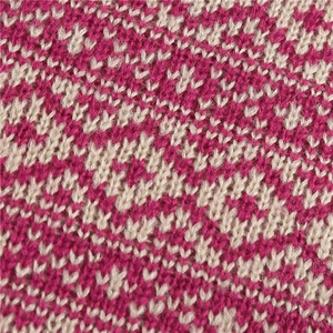 Detail of diamond pattern knit texture on thermal neck gaiter in rose and cream