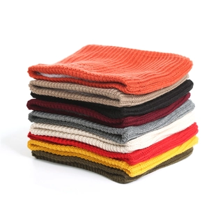 Detail of assorted knitted neck warmers with thick white fleece lining and warm texture