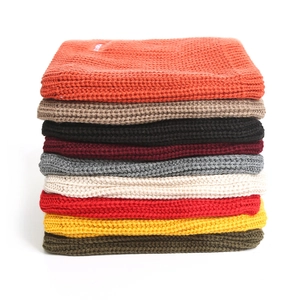 Detailed grid of thick knit neck warmers showing multiple colors and ribbed texture