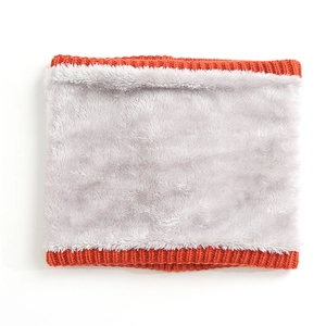 Detailed view of winter knit neck warmer with orange exterior and soft grey fleece lining