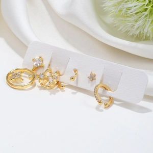 Detail of five-piece gold ear cuff set with star motifs and sparkling zircon accents