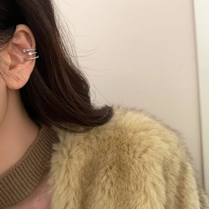 Close-up of triple-layered star ear cuff with cubic zirconia for non-pierced ears