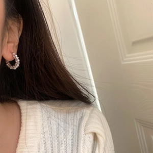 Elegant white pearl hoop earrings with silver pins for women in a minimalist style