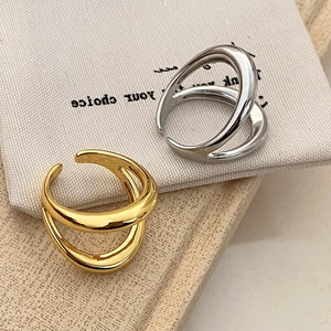 Polished double-layered open metal ring set in gold and silver finish for women