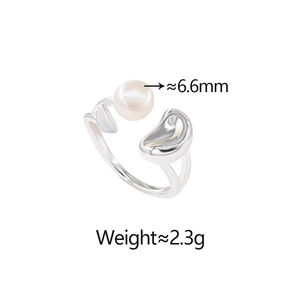 Detailed macro view of 6.6mm freshwater pearl ring with organic silver-toned metal drop