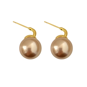 Elegant champagne pearl earrings with round gold metal hooks for a vintage luxury look