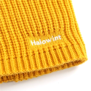 Winter knitted warm yellow neck warmer with thick texture and white Halowint embroidery