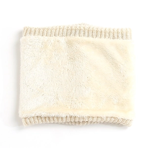 Detail view of beige knitted neck warmer with thick faux fur lining for winter warmth
