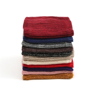 Vertical stack of knitted neck warmers showing various colors and soft ribbed texture
