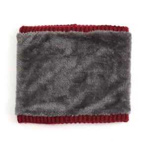 Detail of red knit edge and thick dark gray fleece lining on a winter neck warmer