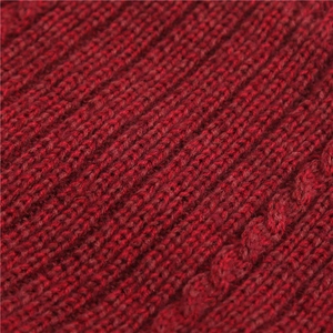 Close-up of wine red knit scarf featuring cable knit pattern and soft ribbed texture