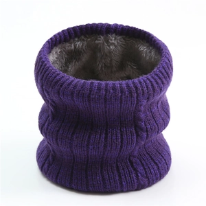 Detail of dark purple cable knit neck warmer with thick grey faux fur lining