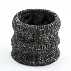 Detail of cable knit neck warmer with thick black fleece lining for winter warmth