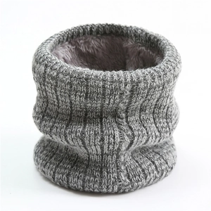 Close-up of winter knit neck warmer featuring thick gray yarn and soft fleece lining