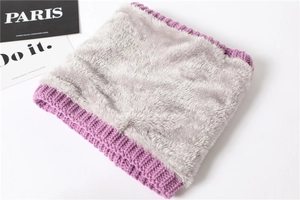 Detail of purple knitted neck warmer with thick grey faux fur lining for winter warmth