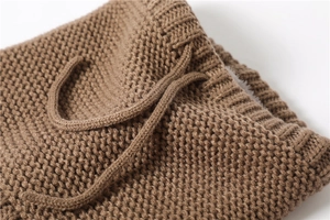 Detailed view of brown knit texture and adjustable drawstring on winter neck warmer